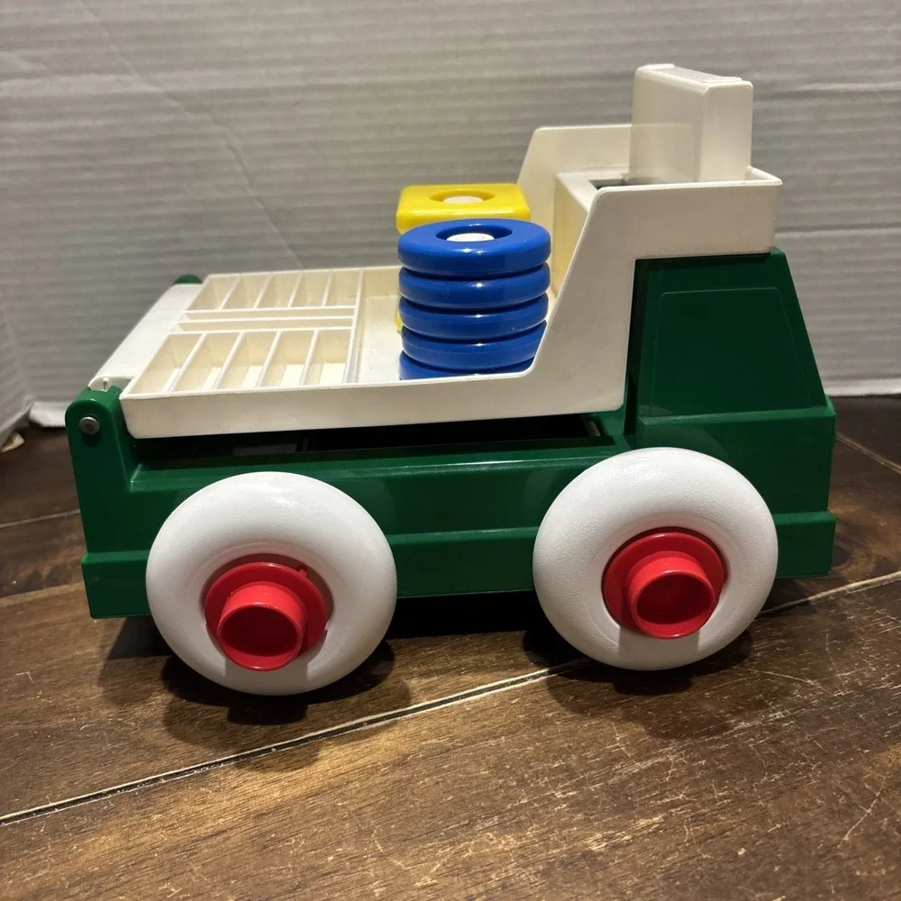 Vintage Johnson & Johnson Green Truck Toy Stack & Dump with Shapes USA 1983‎